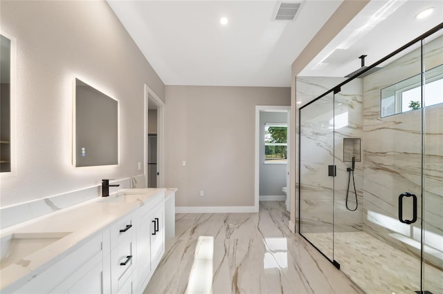 bathroom featuring an enclosed shower, vanity, and toilet