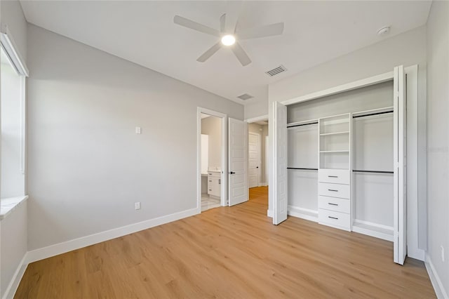 unfurnished bedroom featuring ceiling fan, light hardwood / wood-style floors, and a closet