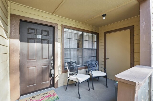 entrance to property featuring a porch