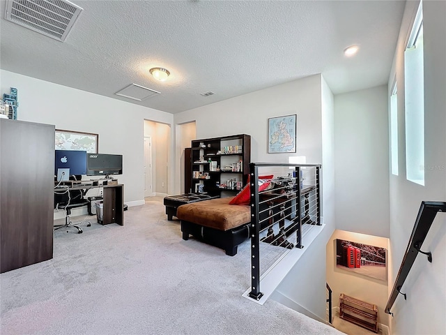 carpeted bedroom featuring a textured ceiling