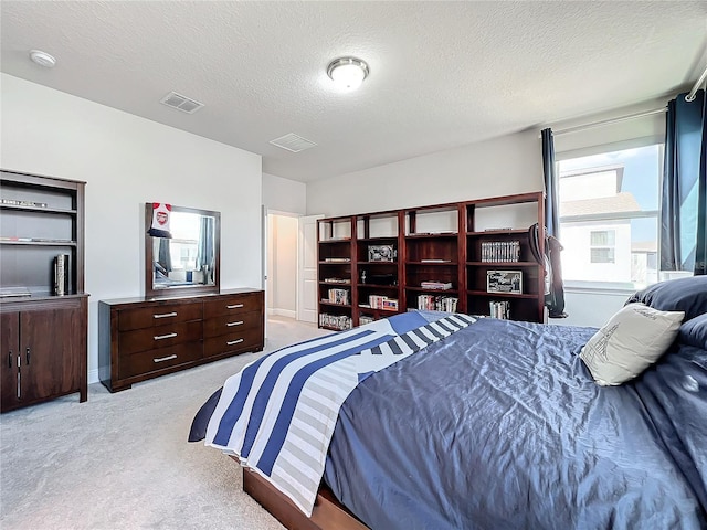 carpeted bedroom with a textured ceiling