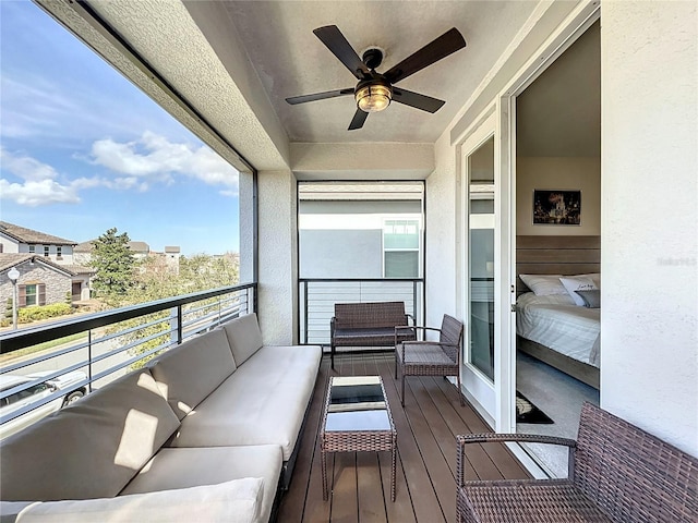 balcony featuring an outdoor hangout area and ceiling fan