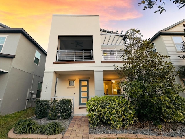 view of front of property with a balcony