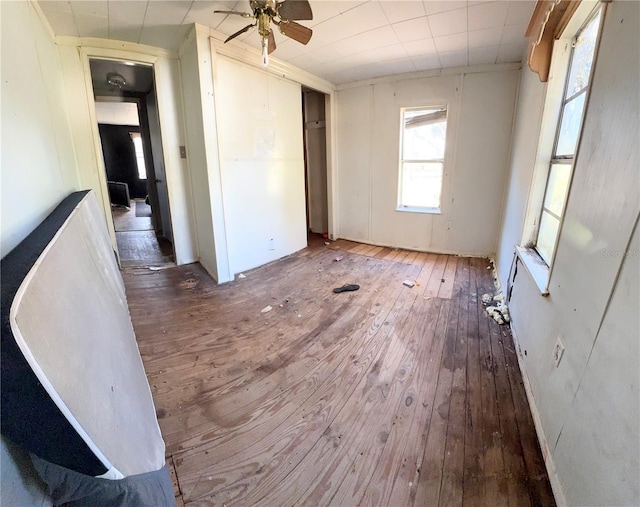 unfurnished room featuring hardwood / wood-style flooring and ceiling fan