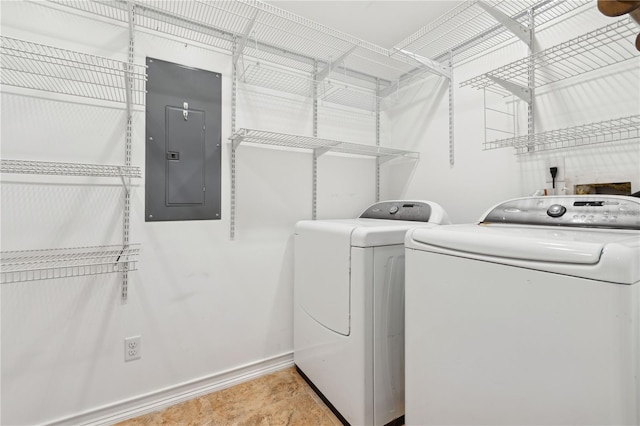 laundry area featuring electric panel and washer and dryer