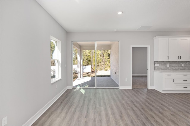 unfurnished living room with light hardwood / wood-style floors