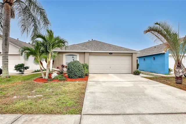 single story home with a garage and a front lawn