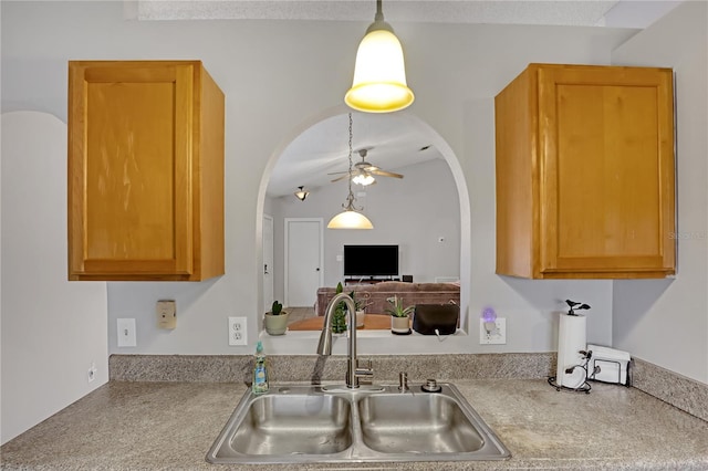 kitchen featuring sink and ceiling fan