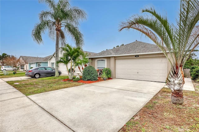 single story home with a garage and a front lawn