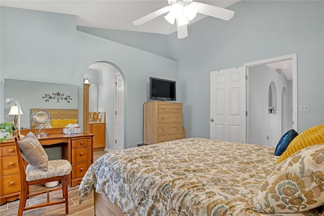 bedroom with vaulted ceiling, ceiling fan, and light hardwood / wood-style flooring