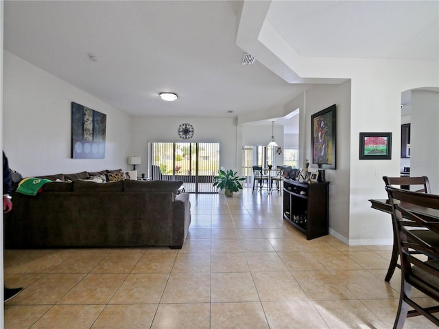 living room with light tile patterned flooring