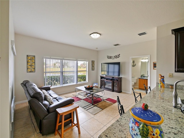 living room with light tile patterned flooring