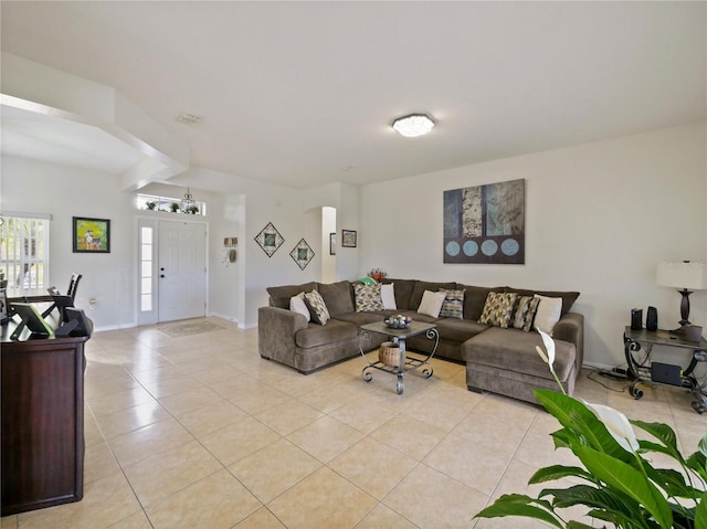 living room with light tile patterned flooring