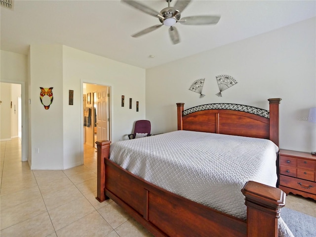 tiled bedroom with ensuite bath and ceiling fan