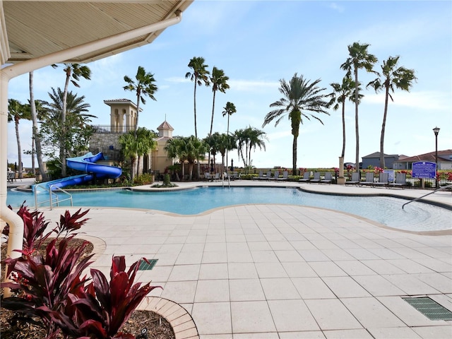 view of swimming pool featuring a patio area and a water slide