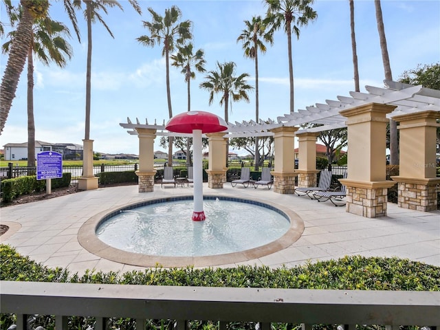 view of swimming pool with a pergola, a water view, and a patio