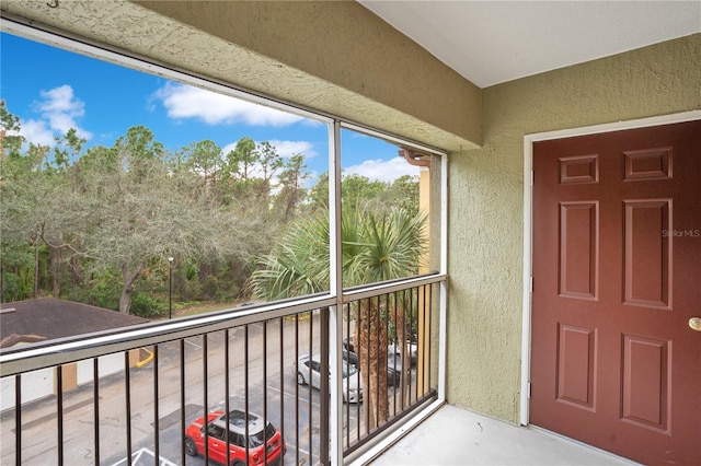 doorway to property featuring a balcony