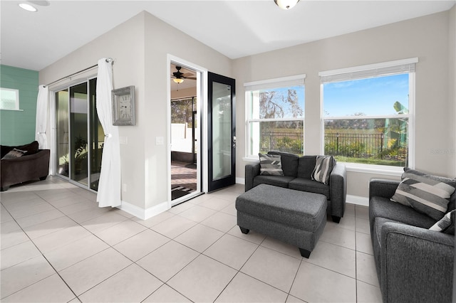 tiled living room with ceiling fan