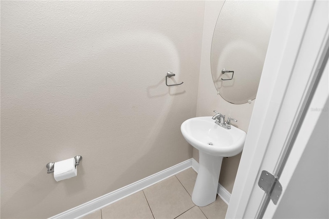 bathroom with tile patterned flooring and sink