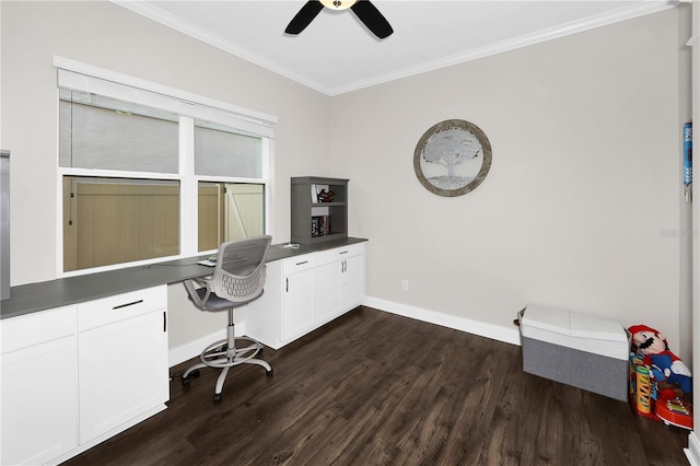 office with ceiling fan, dark hardwood / wood-style flooring, crown molding, and built in desk