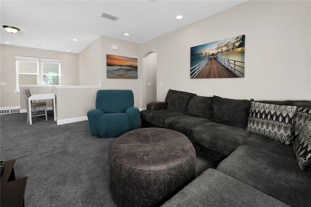 living room featuring dark colored carpet