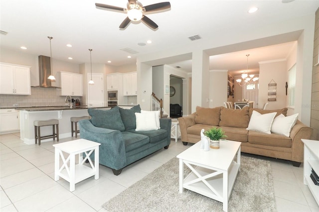 living area with light tile patterned floors, visible vents, and recessed lighting