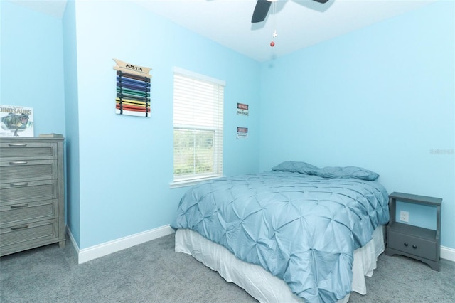 bedroom with carpet flooring, a ceiling fan, and baseboards