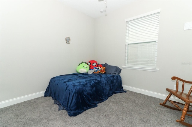 carpeted bedroom with baseboards