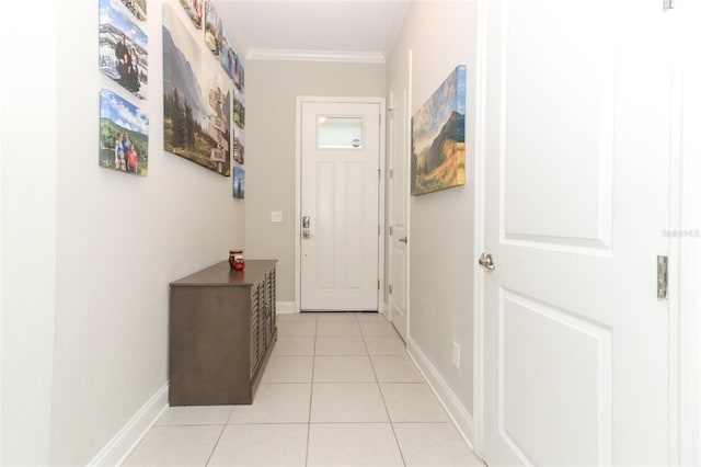 doorway featuring light tile patterned flooring, crown molding, and baseboards