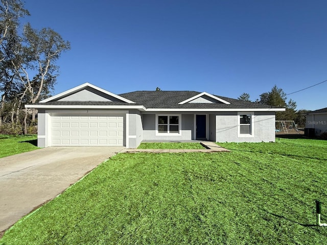 single story home featuring a front lawn and a garage