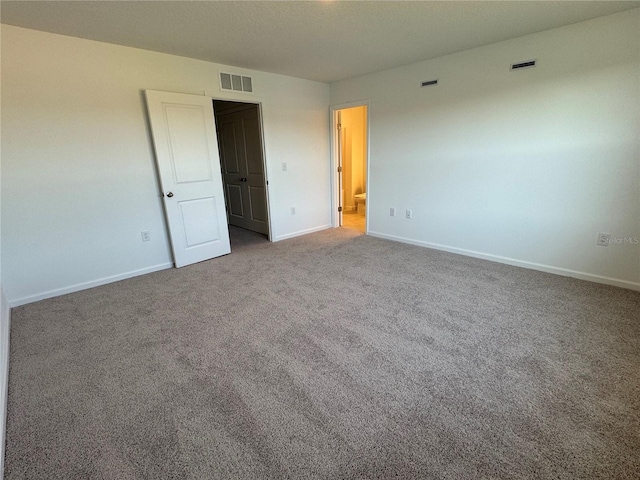 unfurnished bedroom with carpet