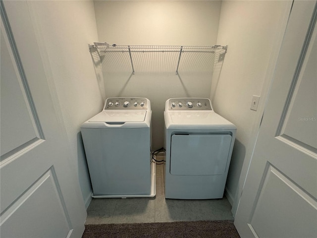 laundry room featuring washing machine and dryer