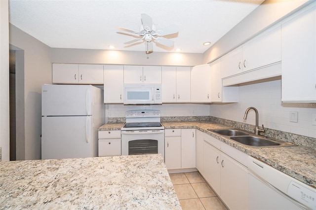 kitchen with white appliances, light tile patterned floors, white cabinetry, ceiling fan, and sink