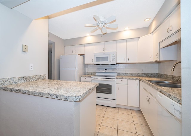 kitchen featuring white appliances, light tile patterned floors, white cabinetry, ceiling fan, and sink