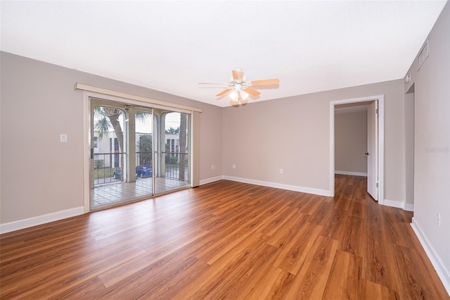 spare room with hardwood / wood-style floors and ceiling fan