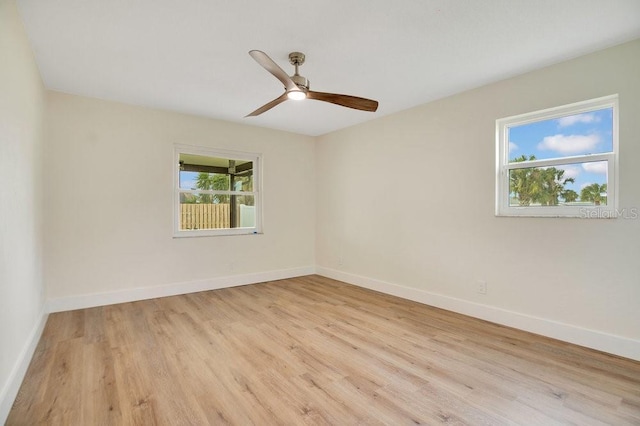 unfurnished room with ceiling fan and light wood-type flooring