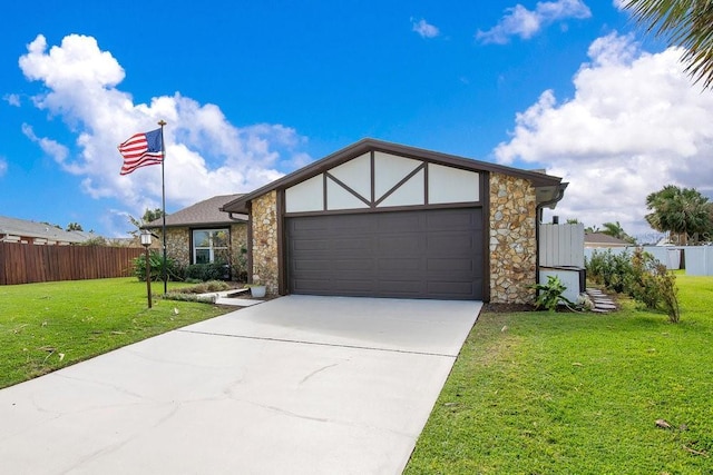 view of front facade with a garage and a front lawn