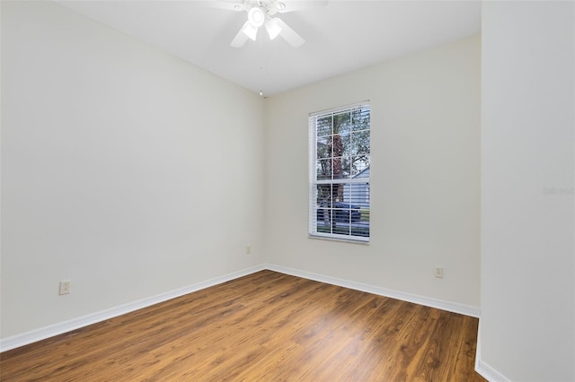 spare room featuring ceiling fan and hardwood / wood-style floors