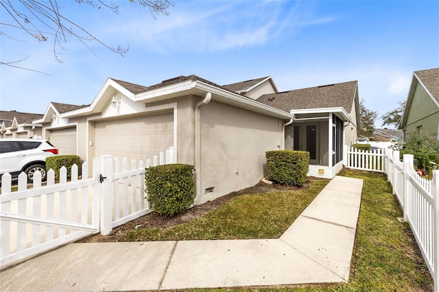 view of side of home with a garage