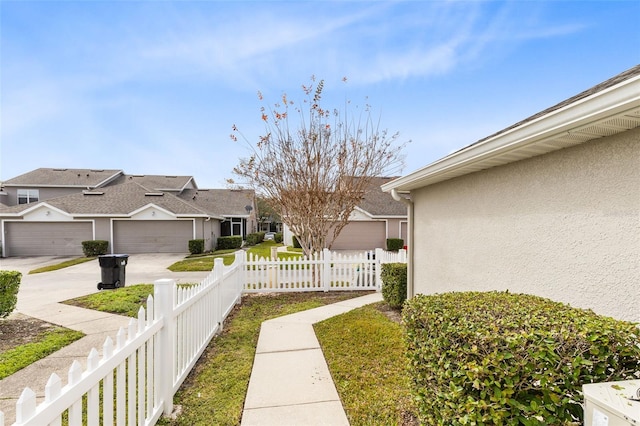 view of yard featuring a garage