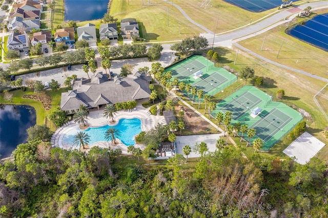 birds eye view of property with a water view