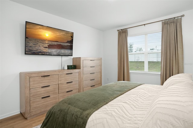 bedroom with light hardwood / wood-style floors