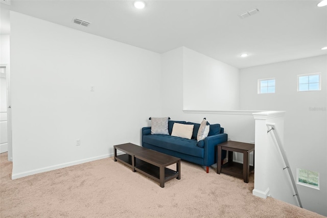 living area featuring light colored carpet