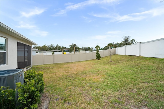 view of yard with central AC