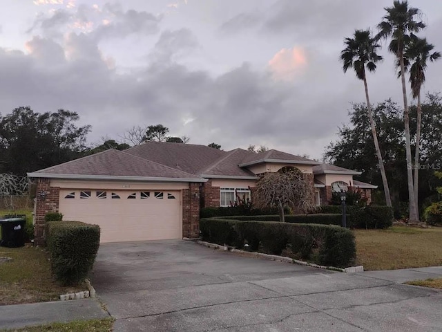 ranch-style house featuring a garage