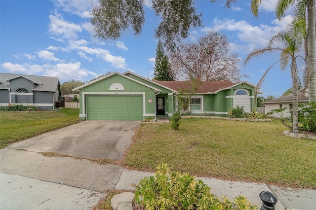 ranch-style house with a garage and a front lawn