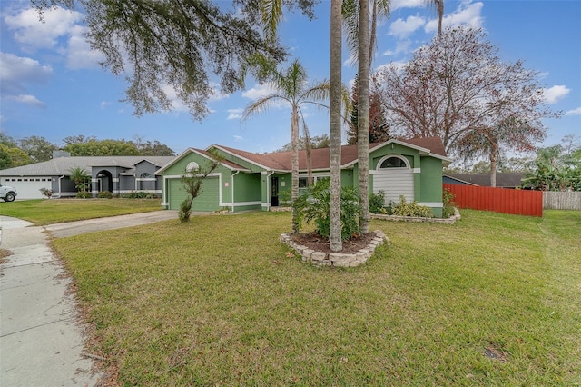 ranch-style home with a front yard and a garage