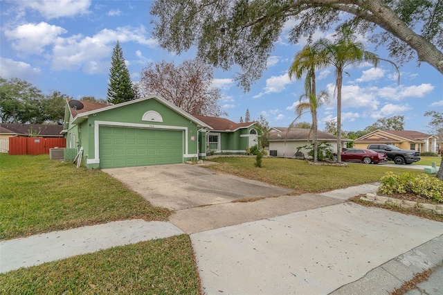 ranch-style home with a garage and a front yard