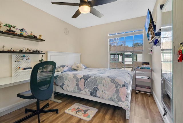 bedroom featuring wood-type flooring and ceiling fan