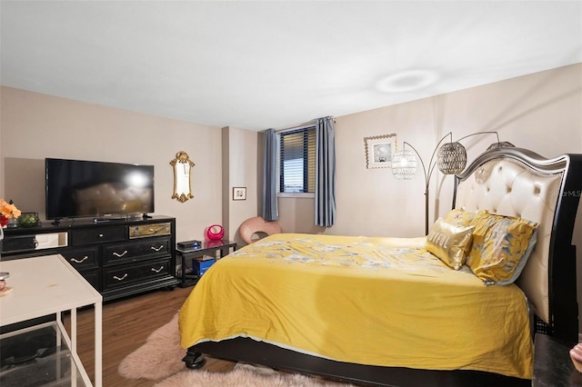 bedroom with wood finished floors